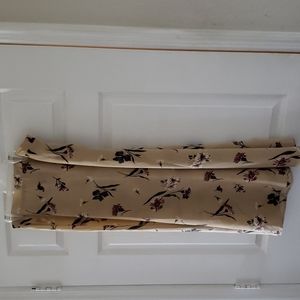 Tan skirt with flower accents